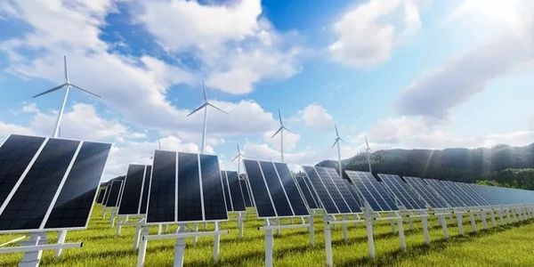 fans panels A field with many solar panels and wind mills.